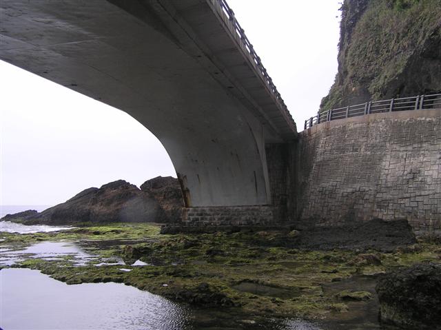 Under the arch of a bridge